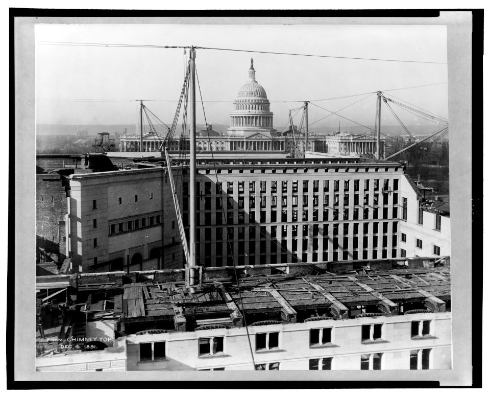 Construction of the Library of Congress - basement and first floor, viewed from chimney top, with U.S. Capitol in background LCCN2005694629