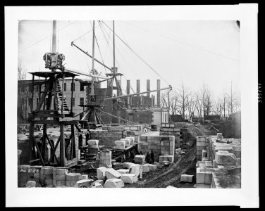 Construction of the United States Treasury Building, Washington, D.C., showing construction equipment and building materials LCCN00652408