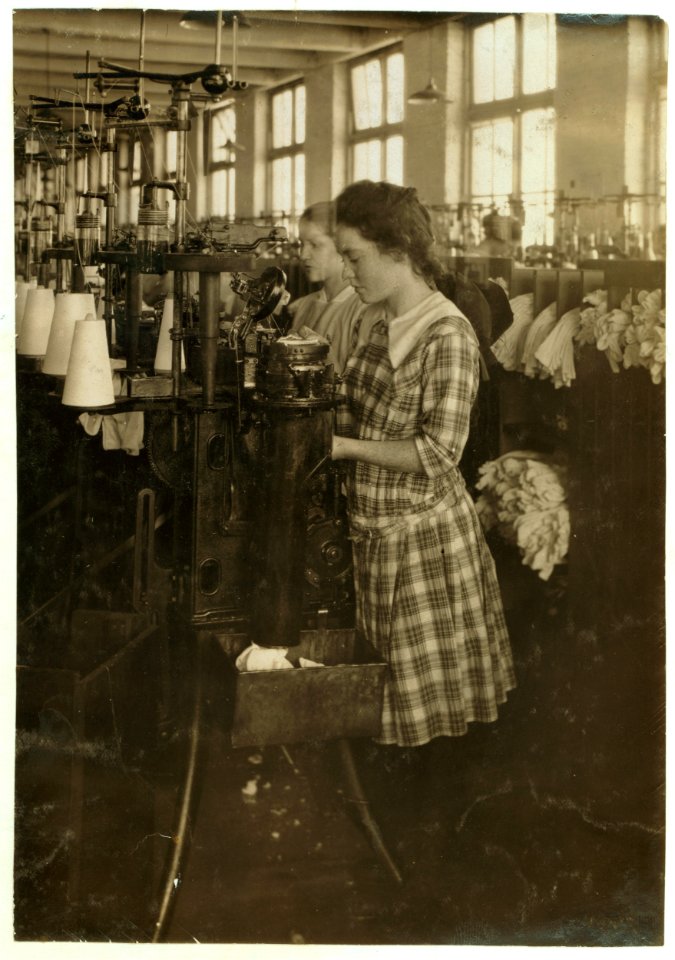 Continuation school girls topping stockings in Ipswich Mills. LOC nclc.03126