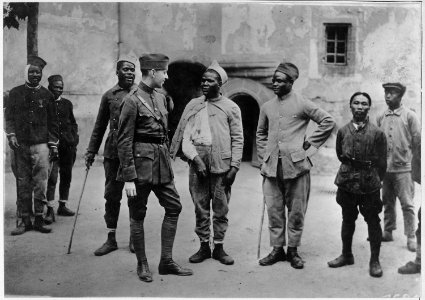 Convalescent Moroccan soldiers telling their war experience to an American Red Cross worker. - NARA - 533565