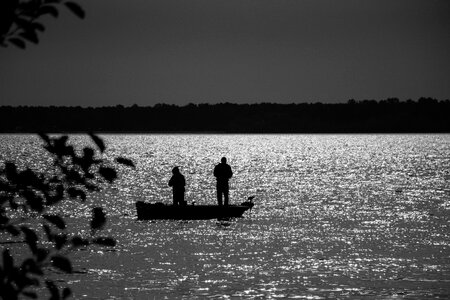 Water fisherman sunset photo