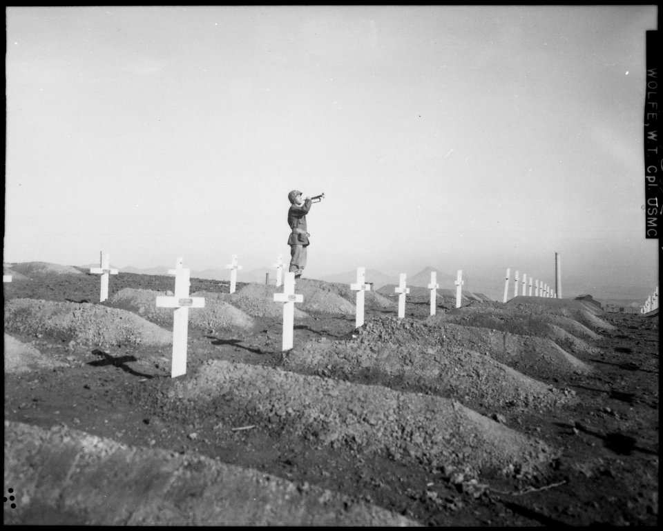 Corporal. Charles Price sounds Taps over the graves of fallen Leathernecks during memorial services at the First... - NARA - 532410