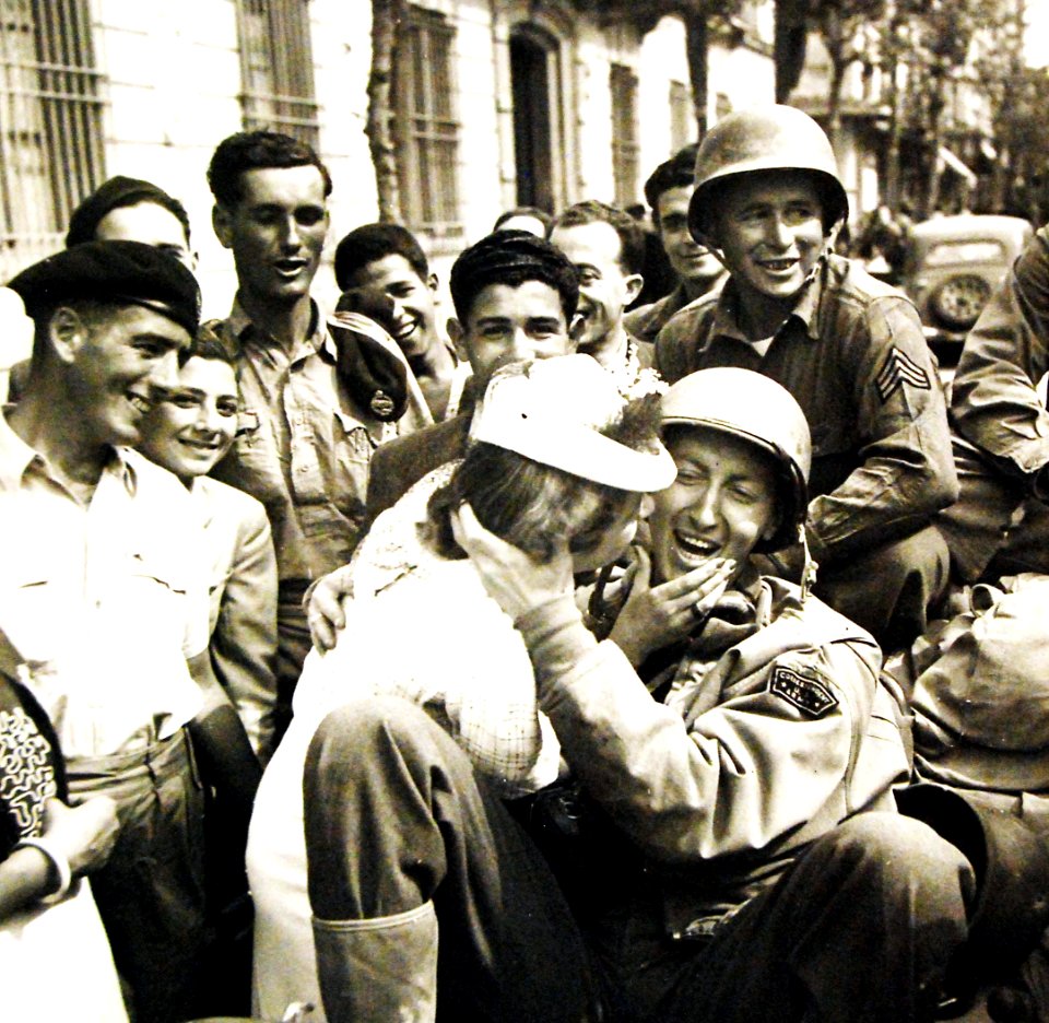 Correspondent Ralph G. Martin is kissed at Porto Farina, Battle of Tunisia, WWII (27511079051)