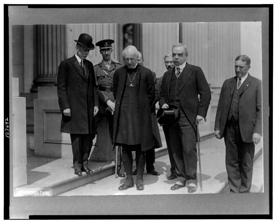Cosmo Gordon Lang, Archbishop of York, Major Crawford Stuart and five others, full-length portrait standing on sidewalk LCCN2001695465