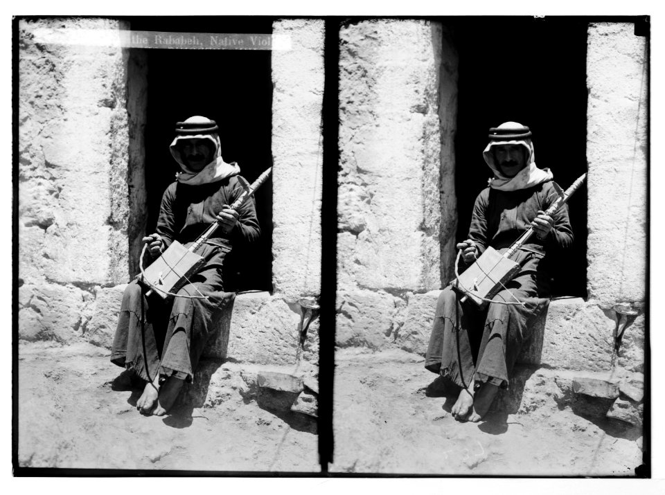 Costumes, characters, etc. Playing the Rababeh, native violin LOC matpc.05634