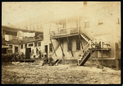 Cottage Street hovels down by the river in Easthampton, Mass., in which a great deal of home work is done on suspenders. LOC nclc.04265