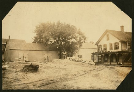 Cottage Street hovels down by the river in which a great deal of home work is done on suspenders. LOC nclc.04263