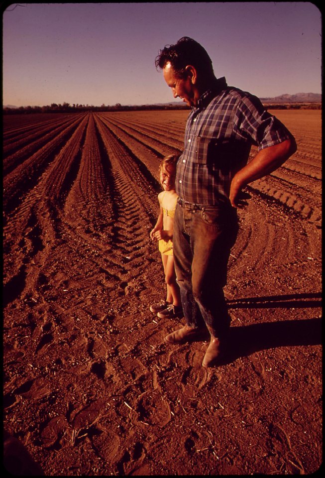 Cotton-farmer-john-vanderslice-and-his-daughter-stand-on-newly-planted-field-may-1972 7006492928 o