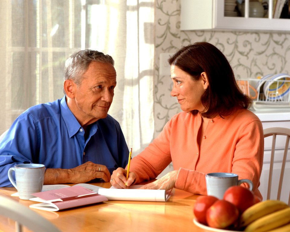 Couple sitting at a kitchen table