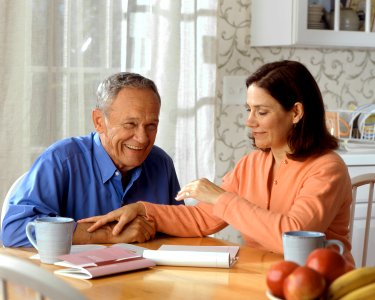 Couple sitting at a kitchen table (2)