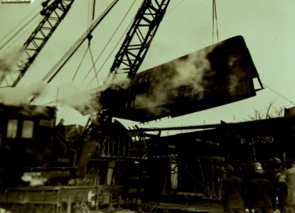Crane swinging the hull section of a submarine chaser into place, 1942 (21903450222)