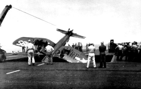 Crashed Vought F4U-1 Corsair aboard the escort carrier USS Tripoli (CVE-64), in 1945
