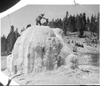 Crater of Lone Star Geyser. Arnald Hague on summit of cone. Yellowstone National Park. - NARA - 517624
