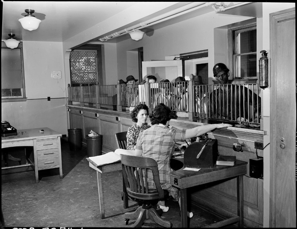 Credit department of the company. Miners are pictured drawing money in advance of payday. Inland Steel Company... - NARA - 541493