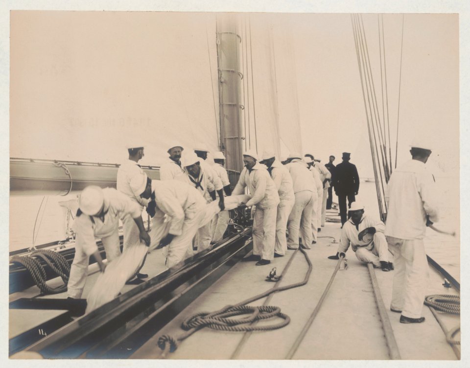 Crew handling sail on the yacht Reliance, winner of 1903 America's Cup LCCN2018645915