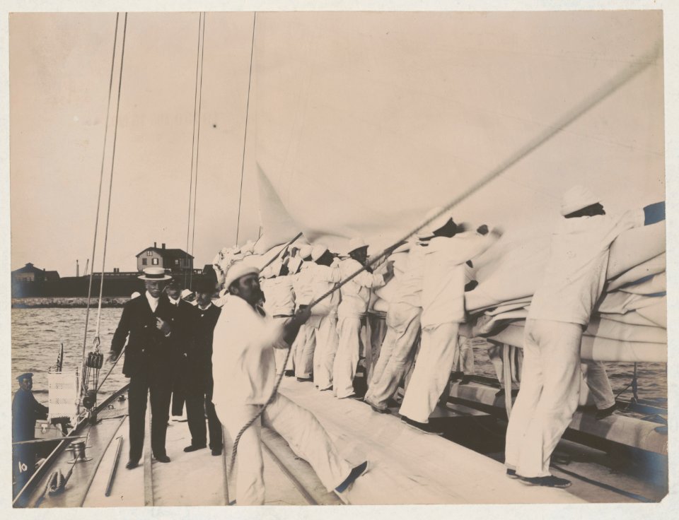 Crew handling sail on the yacht Reliance, winner of 1903 America's Cup LCCN2018645914