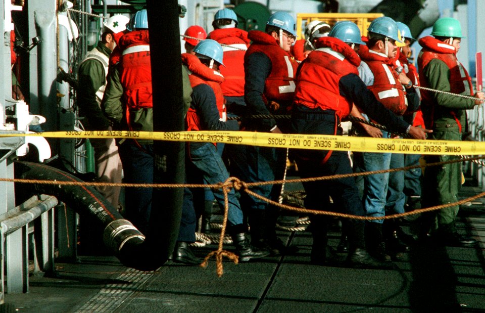 Crew members aboard USS Lang (FF-1060) during an underway replenishment on 1 September 1989 (6457243)