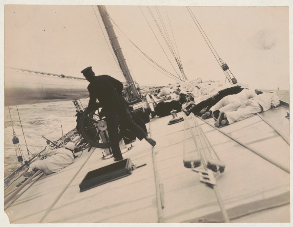 Crew lying on high side to balance the yacht Reliance, winner of 1903 America's Cup LCCN2018645917
