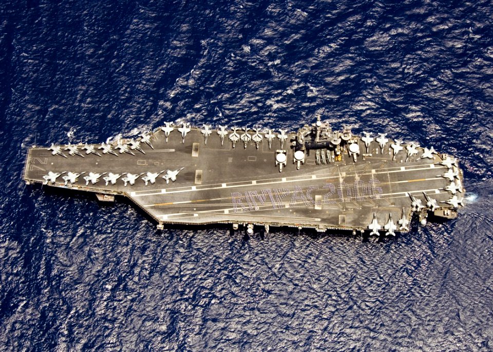 Crew of USS Abraham Lincoln (CVN-72) spelling out RIMPAC 2006 on last day of exercise 060725-N-7981E-170