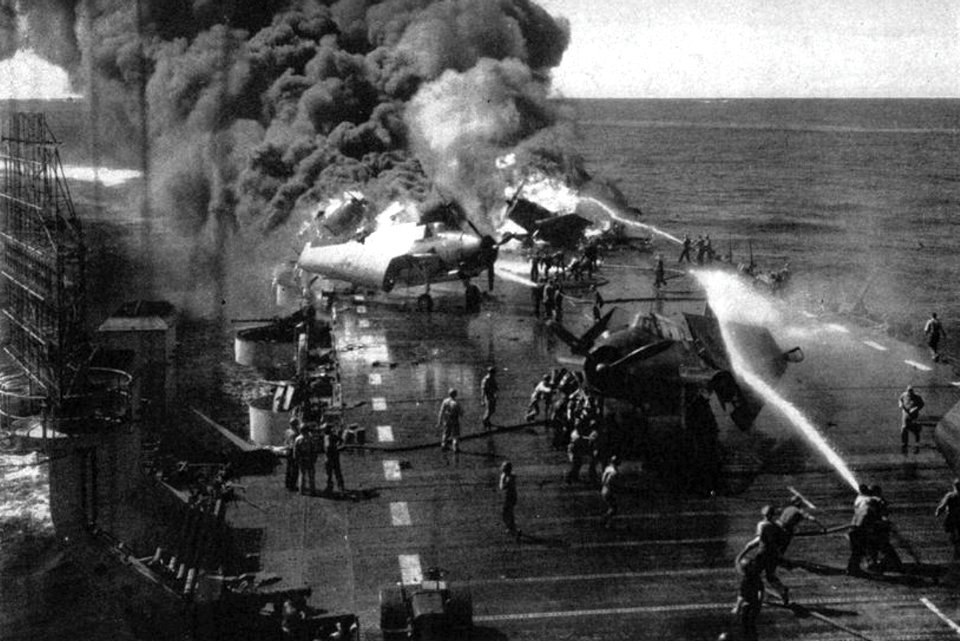 Crewmen fighting fires aboard USS Belleau Wood (CVL-24), on 30 October 1944