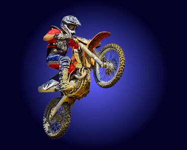 Motocross motorcycle stunt photo