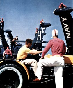 Crewmen servicing F9F-2s on USS Boxer (CVA-21) off Korea 1953