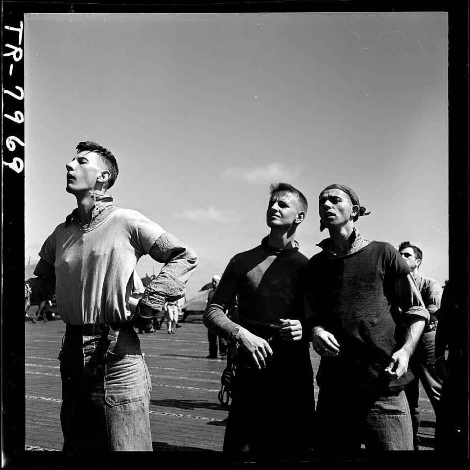 Crewmen watch Navy plane returning to USS Lexington (CV-16) after strike against Japs on Mili. - NARA - 520906