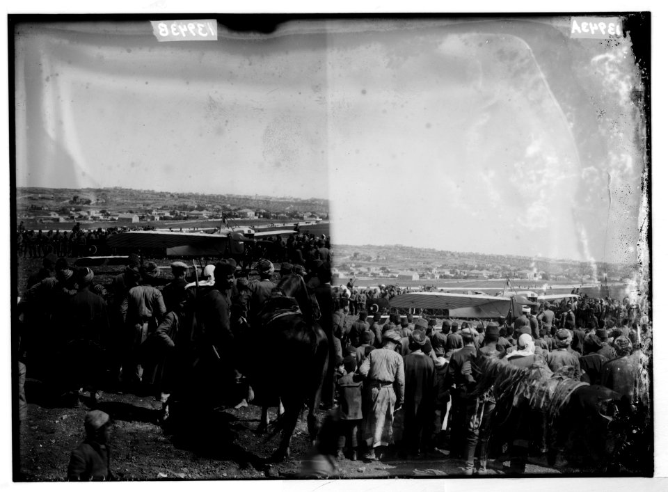 Crowd around Turkish military biplane, closer view ; crowd around turkish military biplane LOC matpc.04784
