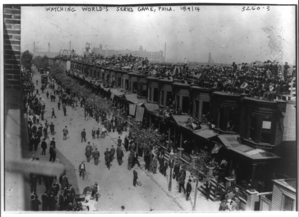 Crowd of people on roofs of rowhouses watching world series game between Boston Braves and Phila. Athletics at Shibe Park, Phila. Oct. 9, 1914 LCCN2001704367
