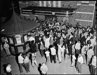 Crowd waiting to attend movie showing on Saturday night. Inland Steel Company, Wheelwright ^1 & 2 Mines, Wheelwright... - NARA - 541429 photo