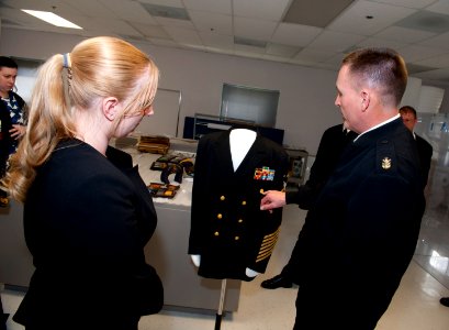 Current MCPON Mike Stevens speaks with a curator about former MCPON Delbert Black's uniform. (16590670134)