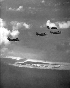 Curtiss SB2C-1 Helldivers of VB-17 in flight over Tarawa Atoll, in November 1943