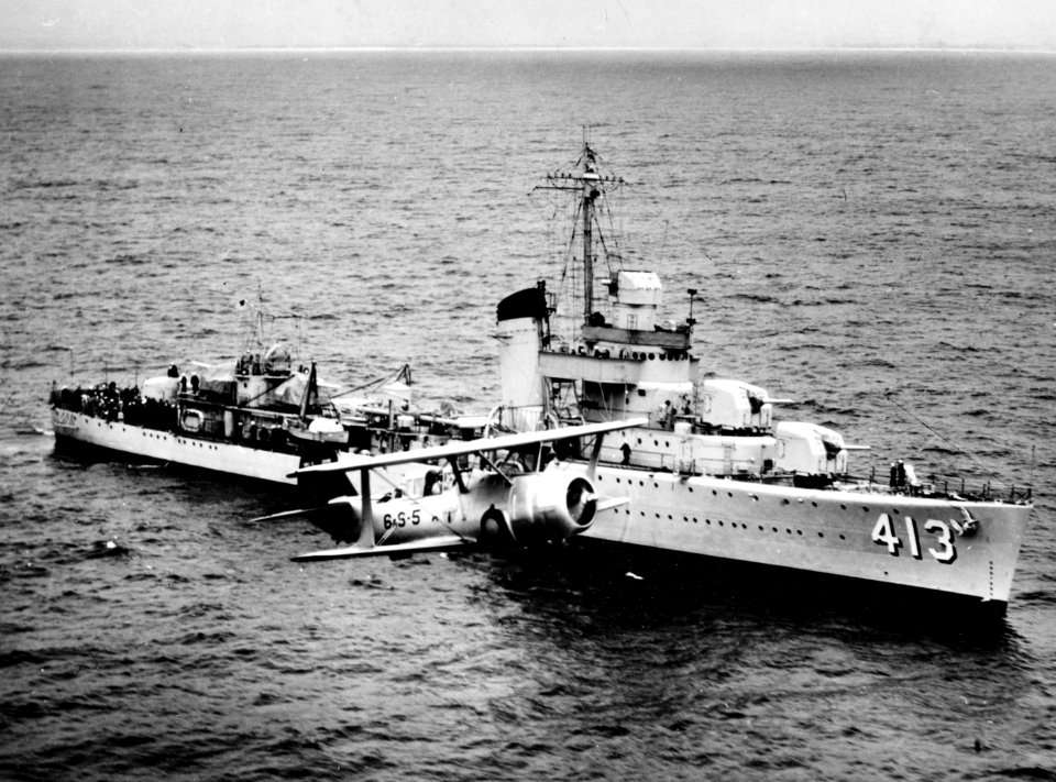 Curtiss SBC-3 Helldiver of VS-6 flies past USS Mustin (DD-413), 26 May 1940 (80-G-1671)