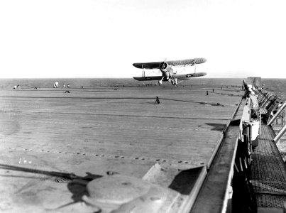Curtiss SOC-3A Seagull landing aboard USS Long Island (AVG-1) on 17 June 1942 (80-G-14257) photo