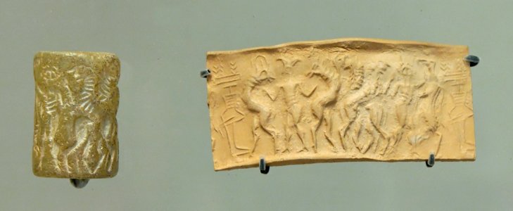 Cylinder seal animals overpowered by gods Louvre AO19811
