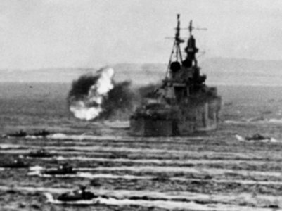 D-Day, 15 June 1944 firing by USS Indianapolis (CA-35), flagship of Fifth Fleet commander Admiral Raymond A. Spruance - LVTs move toward Saipan, past bombarding cruisers, on 15 June 1944 (80-G-231838) (cropped)