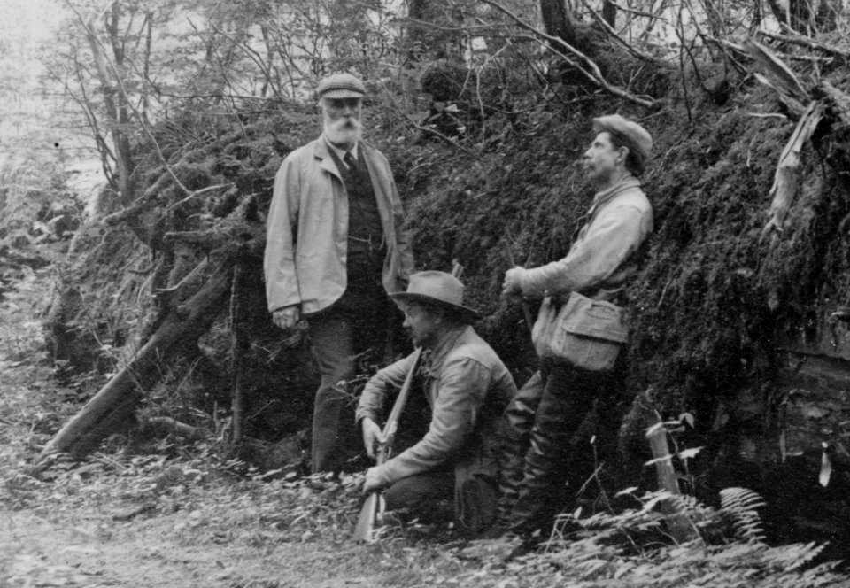 D.G. Elliot, A.K. Fisher, and Robert Ridgway in woods bordering Indian River, Sitka, Alaska, 1899