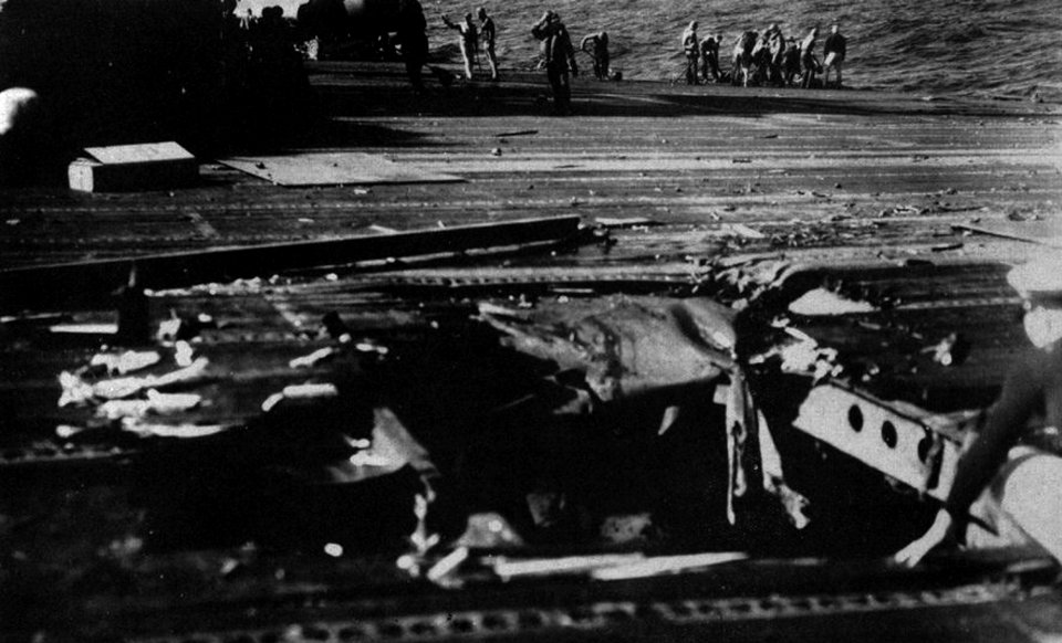 Damaged flight deck aboard USS Ticonderoga (CV-14) after a hit by a Japanese kamikaze, in January 1945