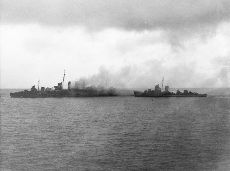 Damaged HMAS Canberra (D33) with US destroyers on 9 August 1942