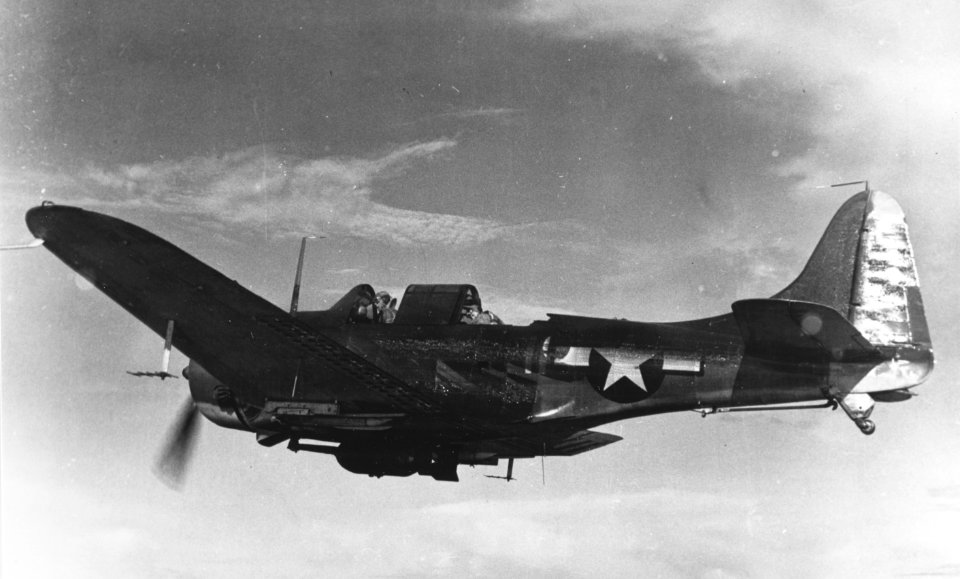 Damaged Douglas SBD-5 of VB-10 in flight on 30 March 1944