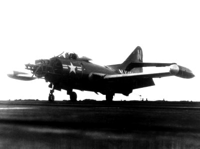 Damaged F9F-2 of VF-91 lands on USS Philippine Sea (CVA-47) in July 1953