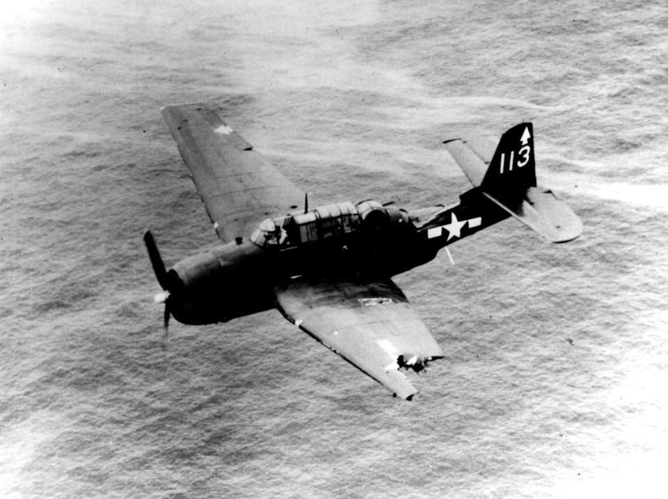 Damaged Grumman TBM-3 Avenger of VT-82 in flight, circa in February 1945 (NH 89380)