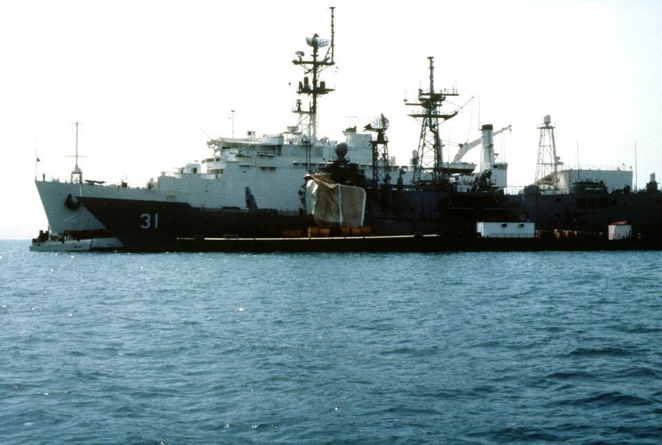 Damaged USS Stark (FFG-31) at Bahrain with USS La Salle (AGF-3) in May 1987