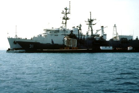 Damaged USS Stark (FFG-31) at Bahrain with USS La Salle (AGF-3) in May 1987