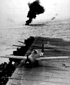Damaged Grumman F4F-4 Wildcat of VF-72 on the flight deck of USS Enterprise, 26 October 1942 (80-G-42560)