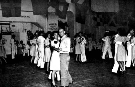 Dance in the hangar deck of USS Tripoli (CVE-64) at Pearl Harbor, Hawaii, in 1945
