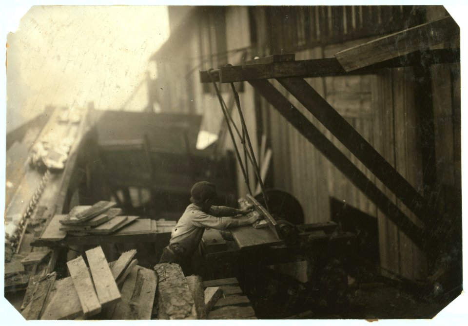 Dangerous work. Charlie McBride. Said twelve years old. This twelve year old boy has a steady job with the Miller and Vidor Lumber Company. He takes slabs out of the chute, which has a LOC cph.3a20817