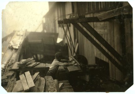 Dangerous work. Charlie McBride. Said twelve years old. This twelve year old boy has a steady job with the Miller and Vidor Lumber Company. He takes slabs out of the chute, which has a LOC cph.3a20817
