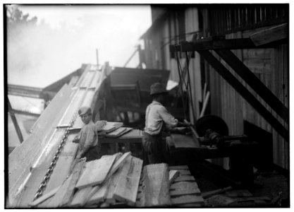 Dangerous work. Charlie McBride. Said twelve years old. This twelve year old boy has a steady job with the Miller and Vidor Lumber Company. He takes slabs out of the chute which has a moving LOC nclc.05546