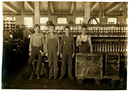 Daniel Mfg. Co., Lincolnton, N.C. Four doffers. Boy on left end (knee pants) said he had worked in mills for 7 years and some nights. At nights they work 12 hours, without any hour off for LOC nclc.01378